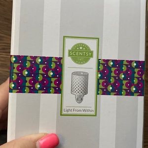 Scentsy light from within wall warmer